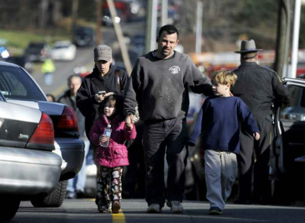 File Photo - Parents accompanying their children after the brutal shootout at the primary school in Newtown. File Photo - Parents accompanying their children after the brutal shootout at the primary school in Newtown.